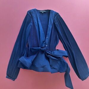 Brand new without tags peplum top in navy blue color.